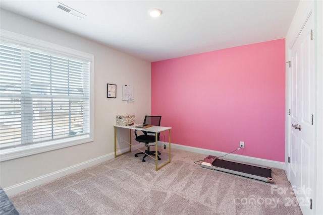 office area with light carpet, visible vents, and baseboards