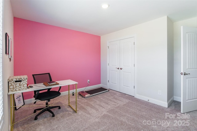 office area with light colored carpet and baseboards
