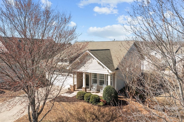 view of front of house with a patio and an attached garage