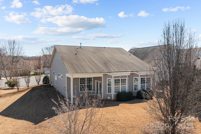 view of front of house featuring roof with shingles