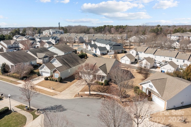 birds eye view of property with a residential view