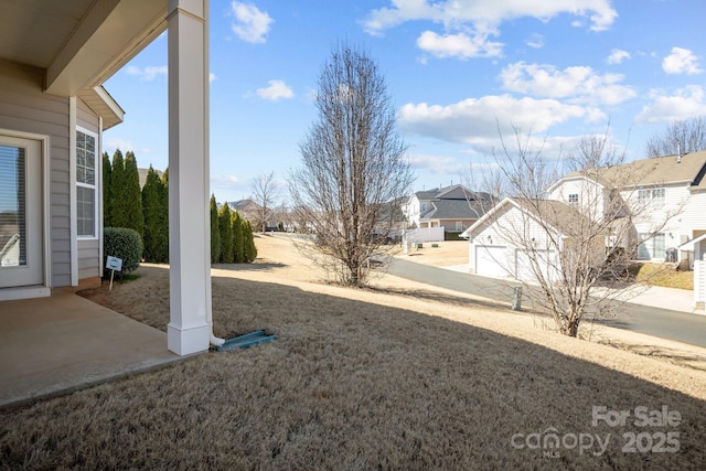 view of yard with a residential view