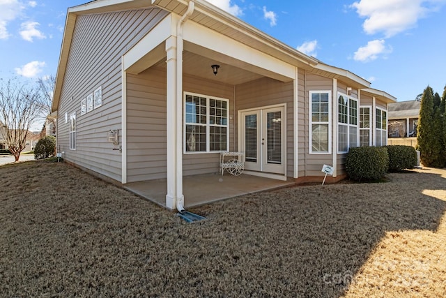 back of property featuring french doors and a patio area