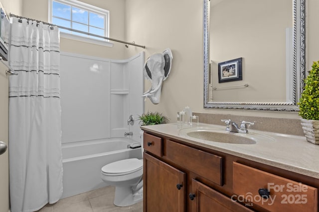 bathroom featuring shower / tub combo with curtain, vanity, toilet, and tile patterned floors