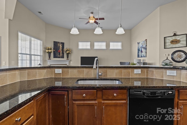 kitchen featuring a sink, pendant lighting, decorative backsplash, and dishwasher