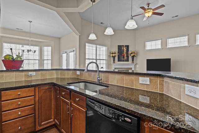 kitchen featuring a sink, visible vents, dark stone counters, and dishwasher