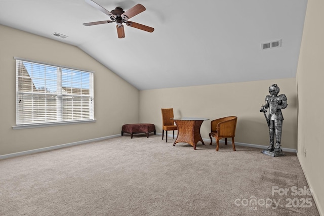 living area featuring lofted ceiling, carpet, visible vents, and baseboards