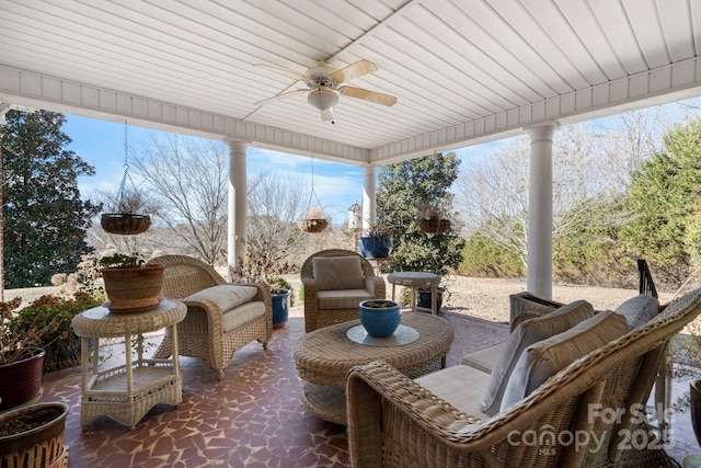 sunroom with a ceiling fan