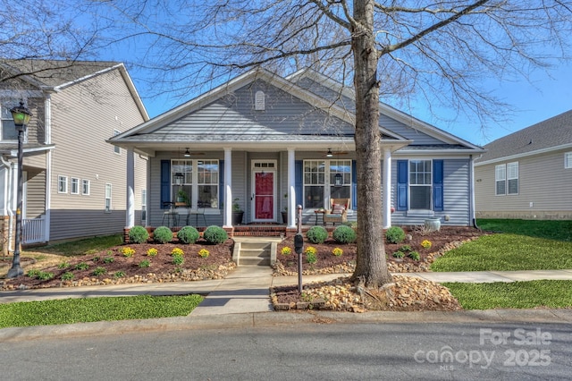 bungalow-style house featuring covered porch and a ceiling fan