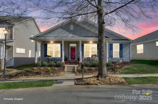 bungalow-style house featuring covered porch