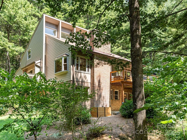 view of home's exterior with brick siding