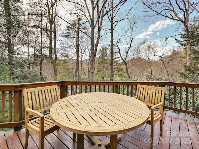 wooden deck with outdoor dining area