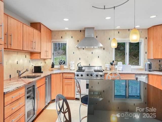 kitchen featuring wine cooler, appliances with stainless steel finishes, a sink, light stone countertops, and extractor fan