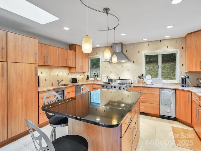 kitchen with a breakfast bar, a center island, light tile patterned floors, decorative backsplash, and wall chimney exhaust hood