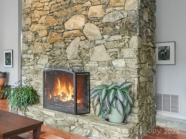 room details with a fireplace and visible vents