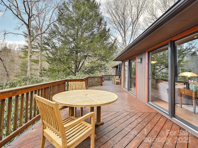 deck featuring outdoor dining area