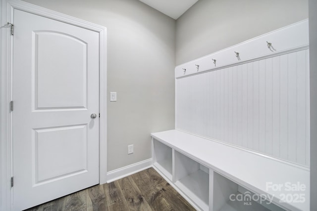 mudroom featuring dark wood-style floors and baseboards