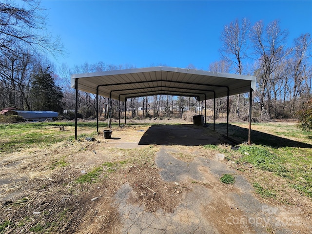 view of parking / parking lot with a detached carport