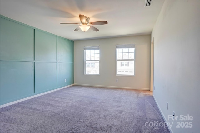 unfurnished bedroom with visible vents, baseboards, carpet, and a ceiling fan