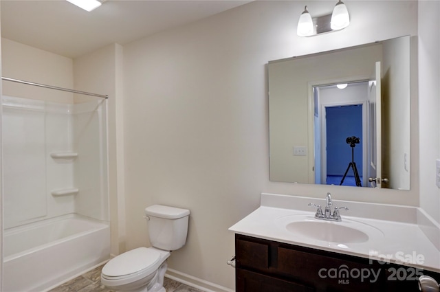 full bathroom featuring shower / tub combination, toilet, vanity, and baseboards