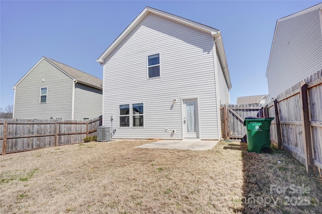 back of house featuring a patio, central air condition unit, a yard, and a fenced backyard