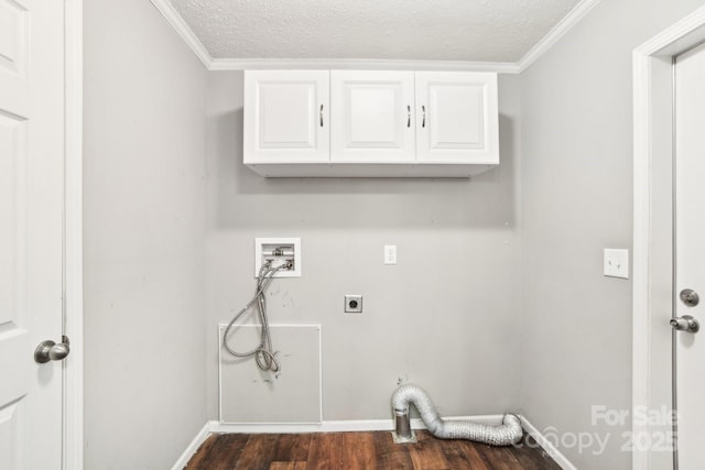 laundry room with cabinet space, baseboards, dark wood-style floors, hookup for a washing machine, and hookup for an electric dryer