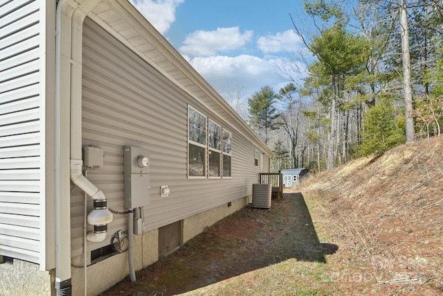 view of side of property with crawl space