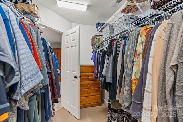 walk in closet with carpet and visible vents