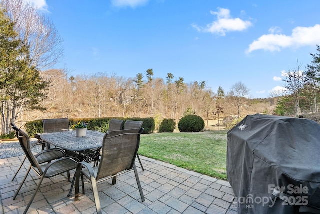 view of patio featuring outdoor dining space and grilling area