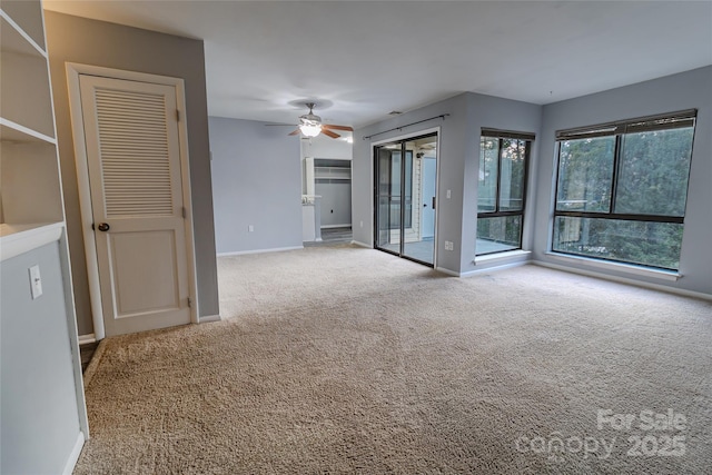 4814 Spring Lake Dr E, Charlotte, NC 28212 - empty room with baseboards, a ceiling fan, and light colored carpet