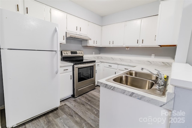 4814 Spring Lake Dr E, Charlotte, NC 28212 - kitchen with freestanding refrigerator, stainless steel electric stove, light countertops, under cabinet range hood, and white cabinetry
