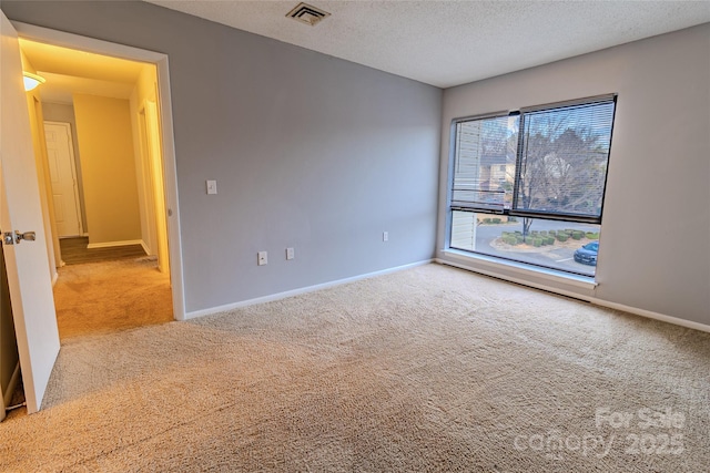 4814 Spring Lake Dr E, Charlotte, NC 28212 - empty room with light carpet, visible vents, a textured ceiling, and baseboards