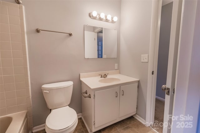 4814 Spring Lake Dr E, Charlotte, NC 28212 - bathroom featuring baseboards, vanity, toilet, and tile patterned floors