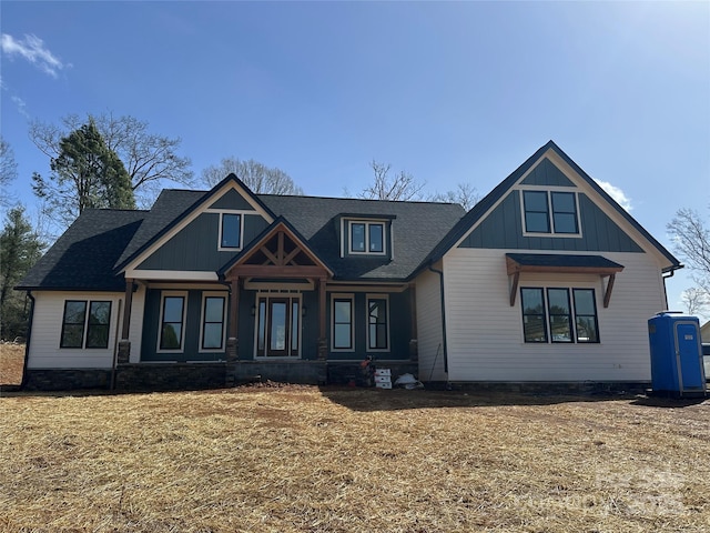 view of front of home featuring roof with shingles