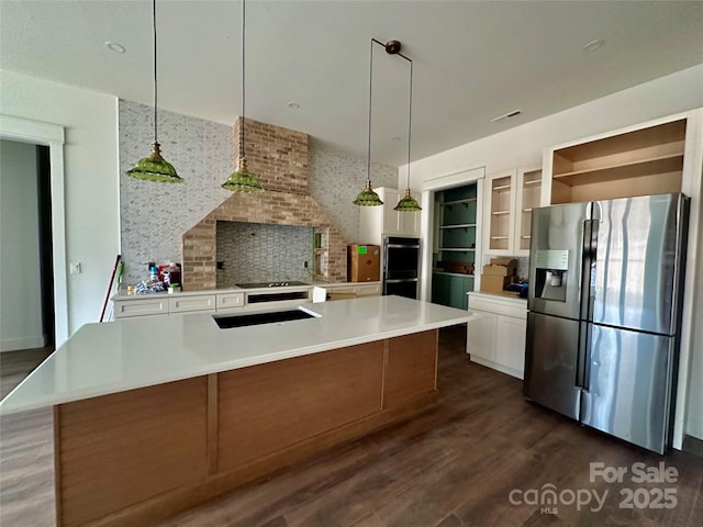 kitchen with white cabinetry, stainless steel fridge, dark wood-style floors, and open shelves