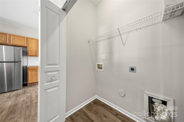 laundry room with gas dryer hookup, laundry area, washer hookup, and wood finished floors