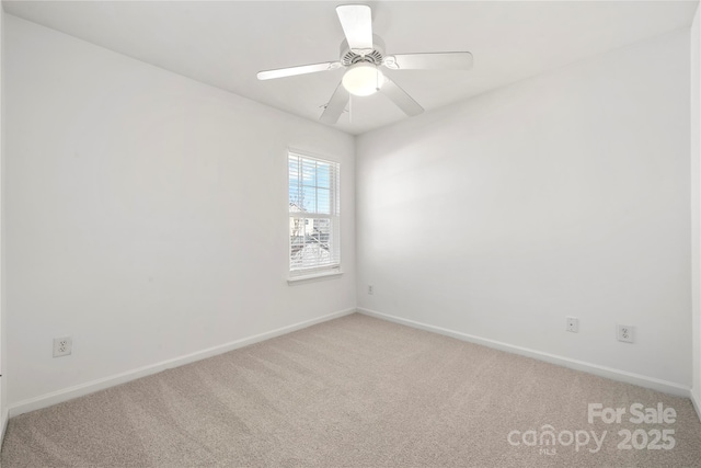 unfurnished room with light carpet, ceiling fan, and baseboards