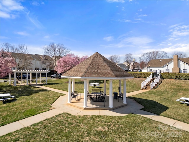 surrounding community with a patio area, a residential view, a pergola, and a yard