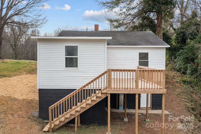 rear view of house with a deck and stairs