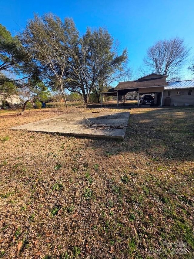 view of yard featuring an attached carport