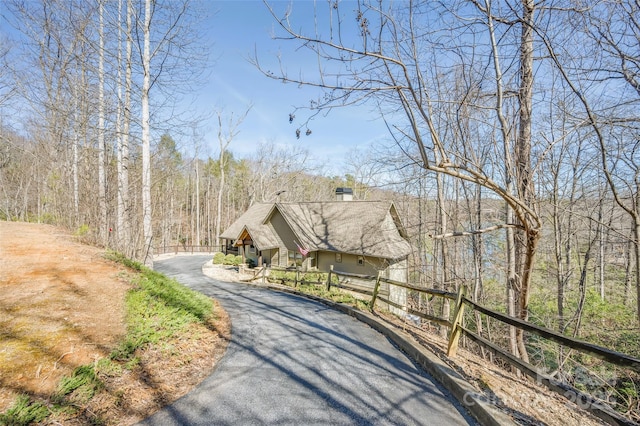 view of street featuring aphalt driveway