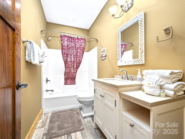 full bath with toilet, shower / bath combo, wood finished floors, and vanity