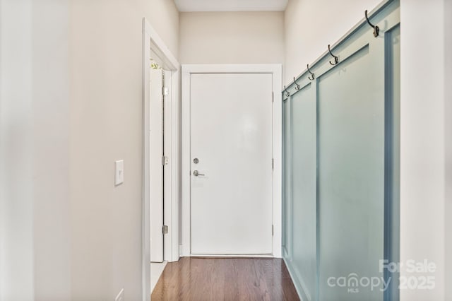 corridor with wood finished floors