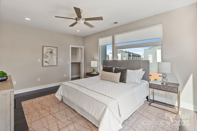 bedroom with visible vents, baseboards, ceiling fan, wood finished floors, and recessed lighting