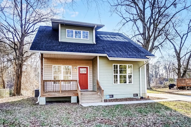 bungalow with crawl space, covered porch, and a shingled roof