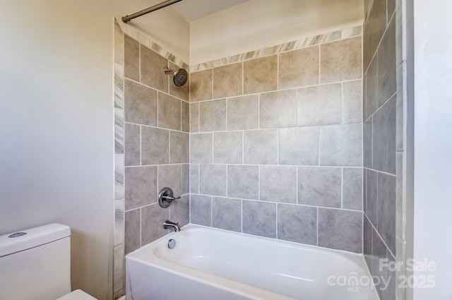 bathroom with toilet and shower / washtub combination