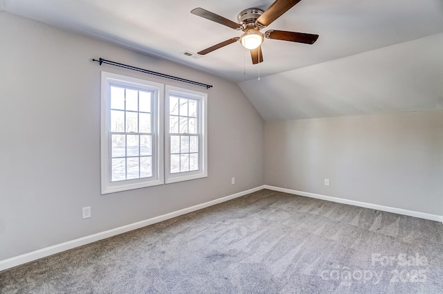 bonus room with lofted ceiling, carpet floors, visible vents, and baseboards