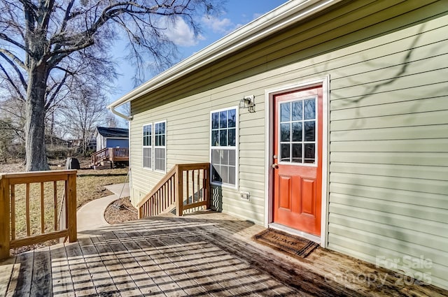 doorway to property featuring a deck