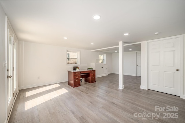 interior space featuring light wood-style flooring, baseboards, and recessed lighting