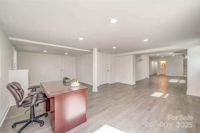 home office with baseboards, light wood finished floors, a wall unit AC, and recessed lighting